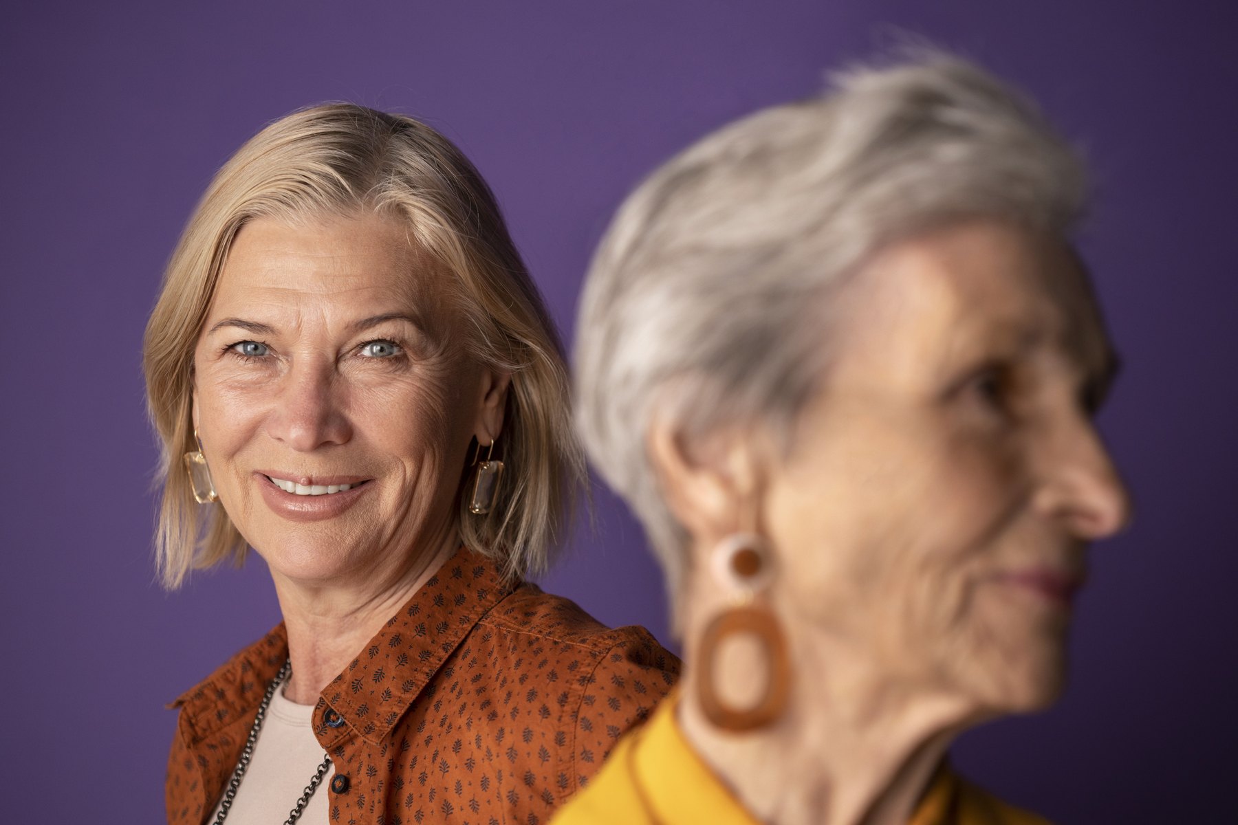 Two older women sitting together.