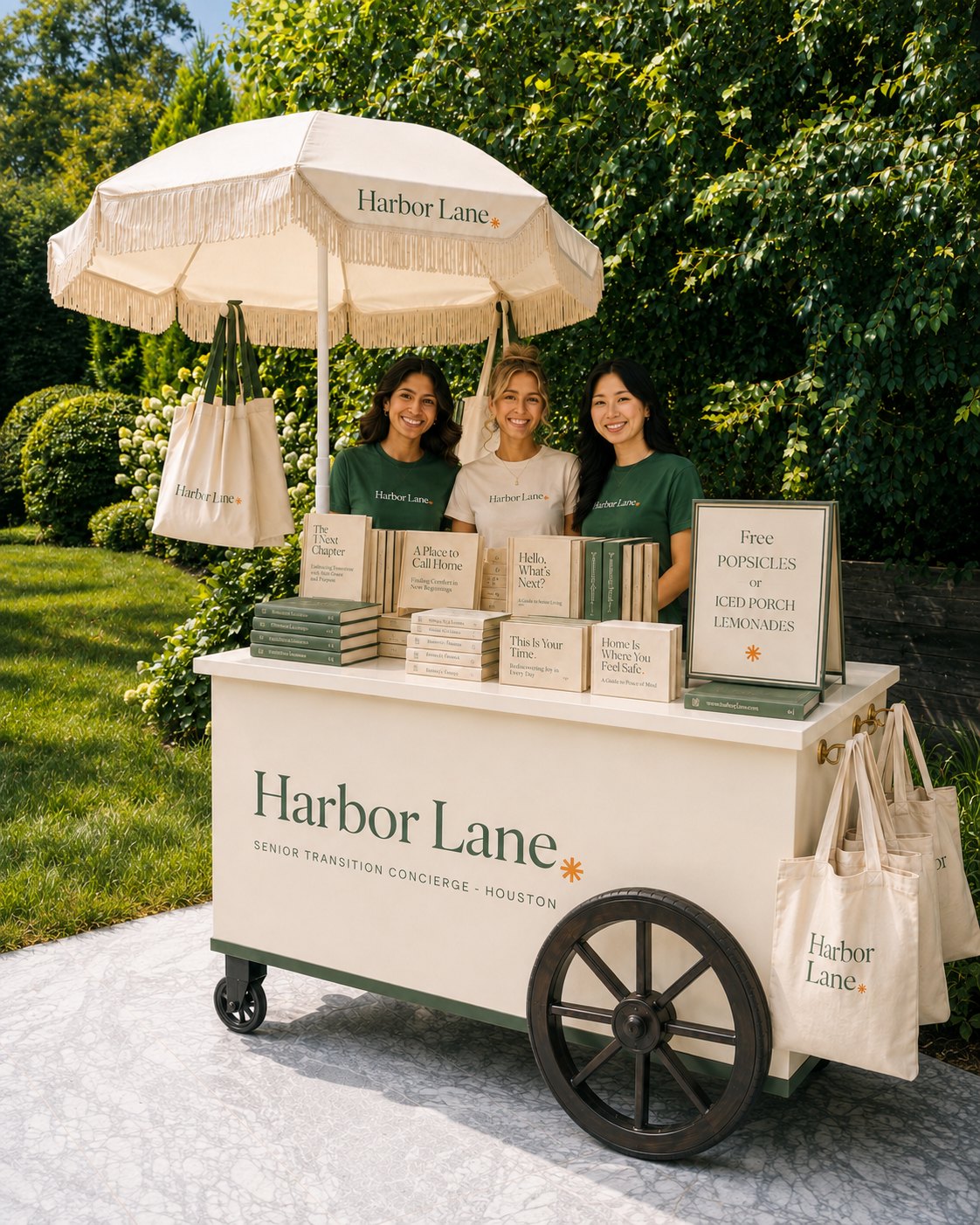 A close look at the Front Porch cart shelves, with large print titles, canvas totes, and a free popsicles sign.