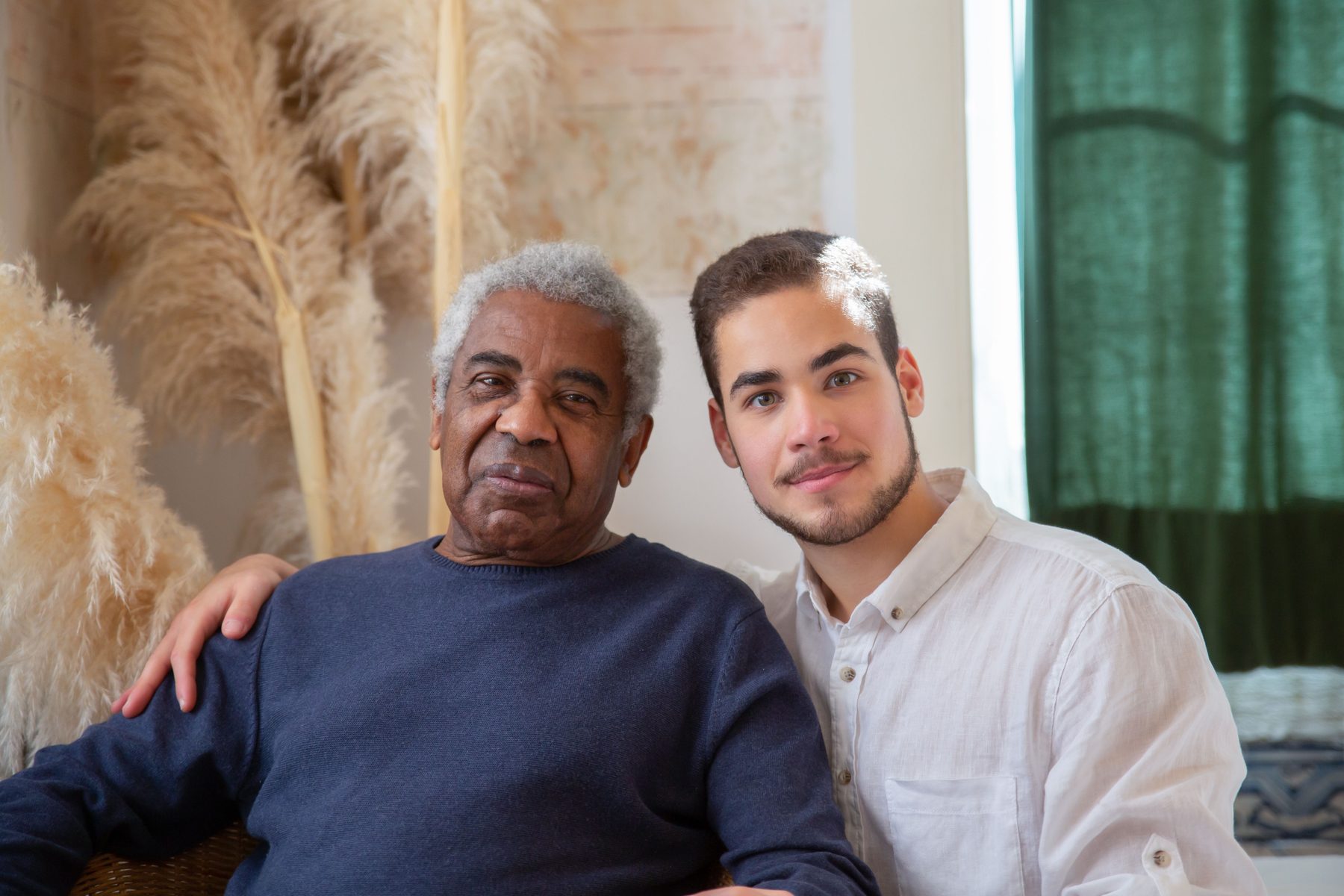 A caregiver and an older adult sorting belongings together, unhurried.
