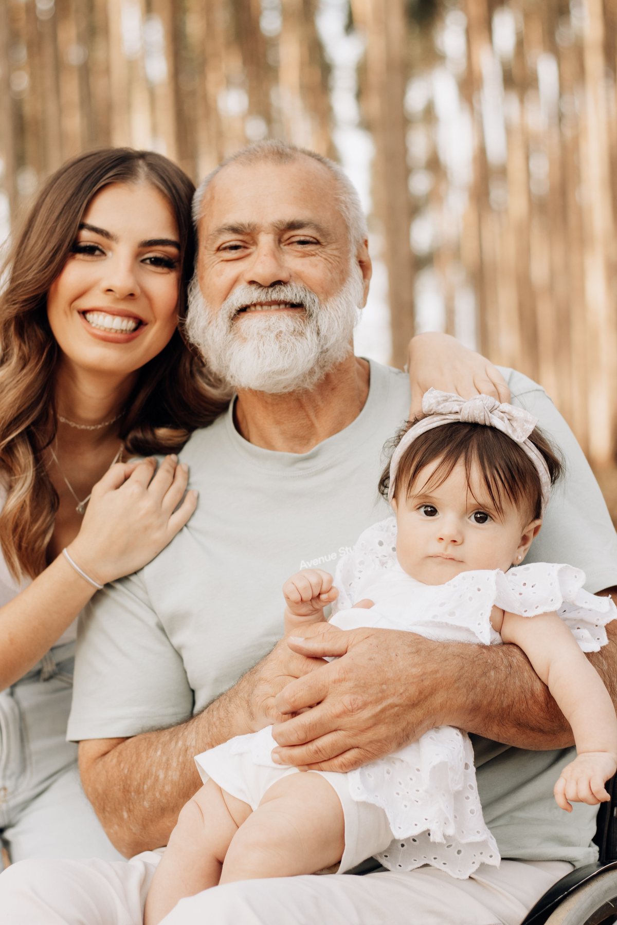 Three generations of a family together at home, relaxed.
